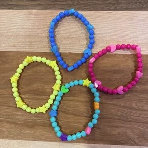 4 Round Beaded bracelets made with funky shapes.